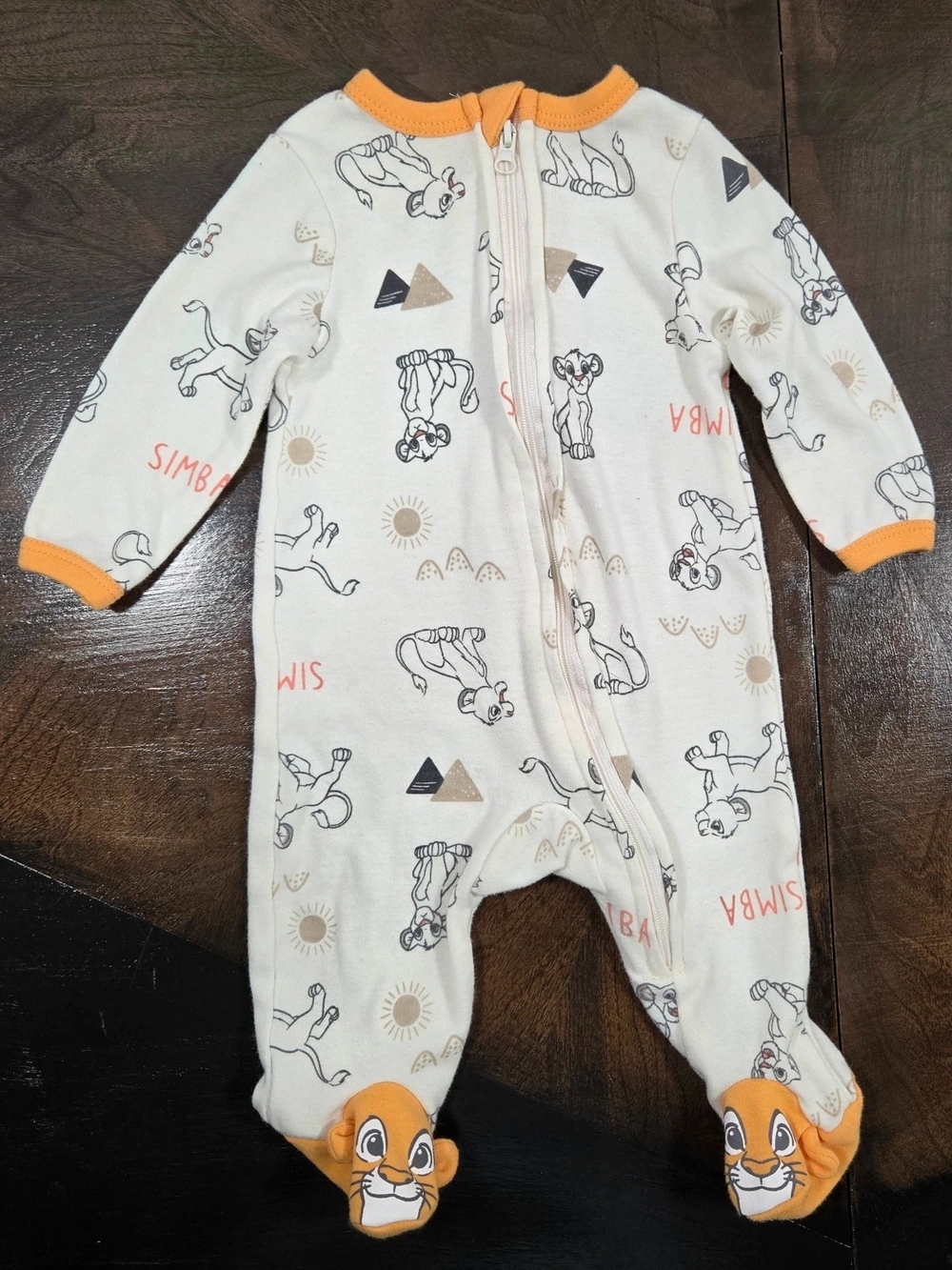 Disney Cream Simba Footed One-Piece with Orange Accents